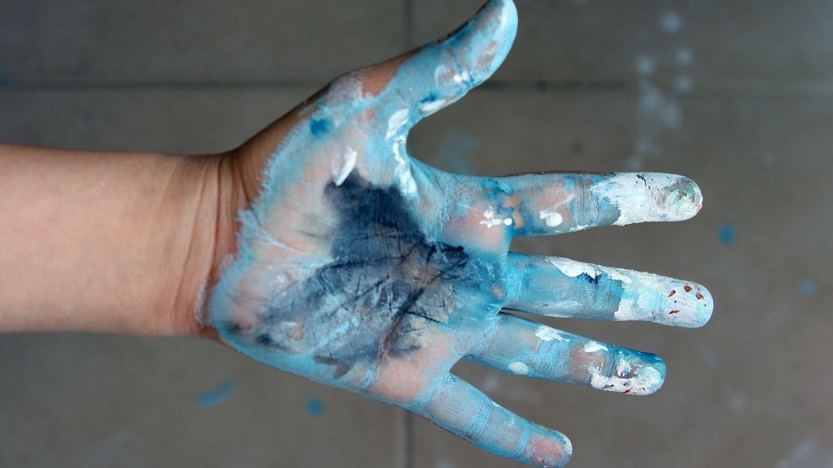 One hand covered in paint for finger painting