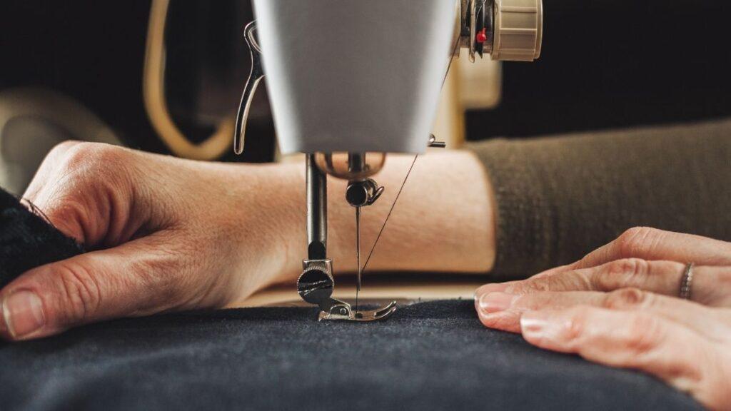 A lady using a sewing machine