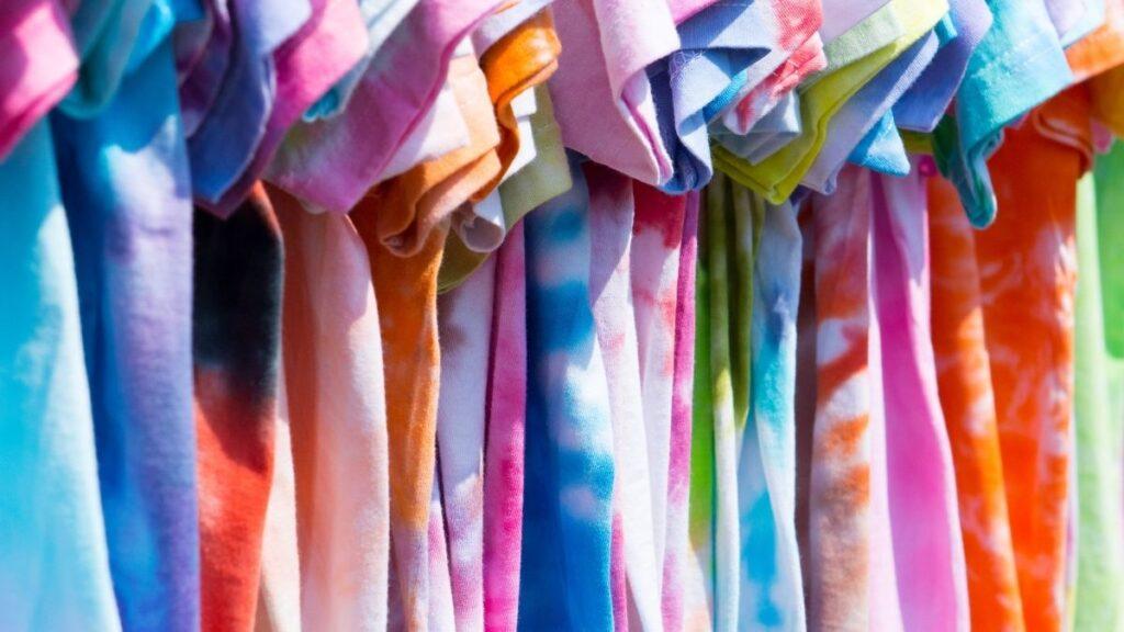 A row of tie dye t-shirts