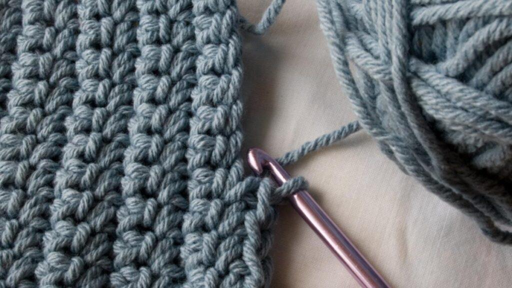 Crochet stitches with blue yarn
