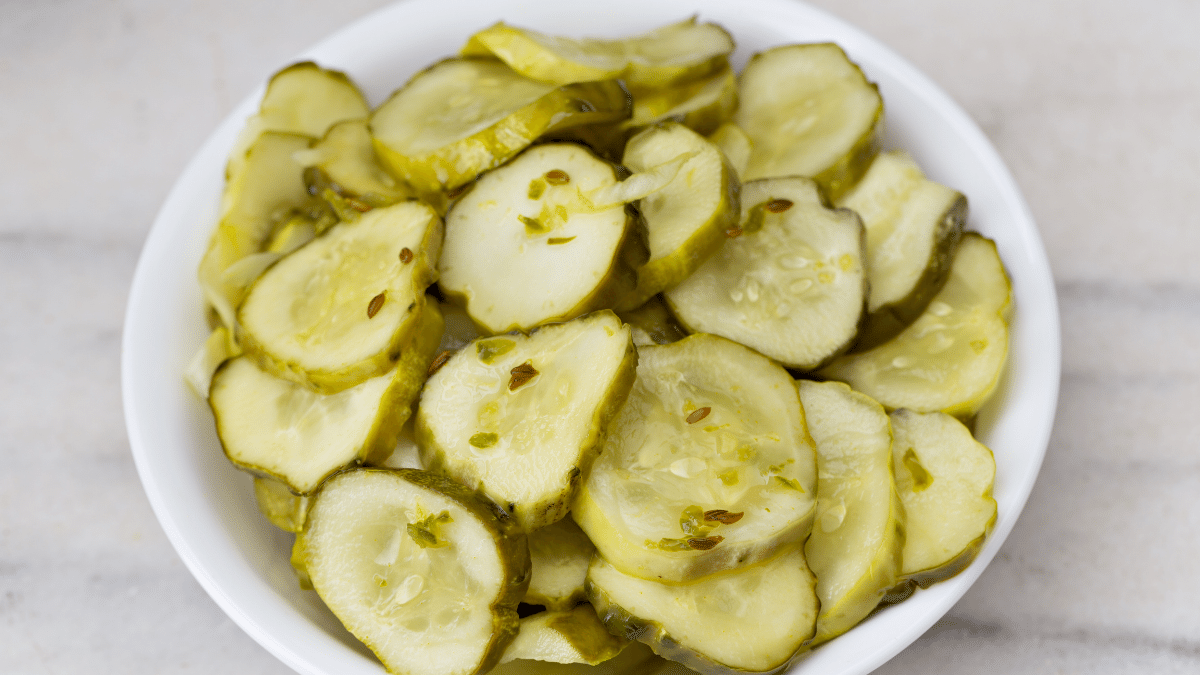 bread and butter pickles in white bowl
